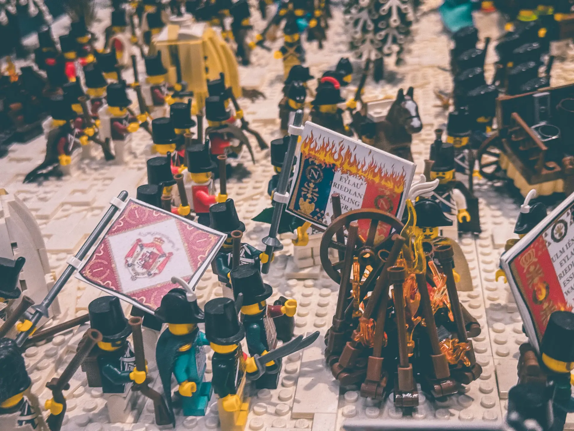LEGO diorama of the retreat from Russia, with massed troops, regimental standards and abandoned guns.
