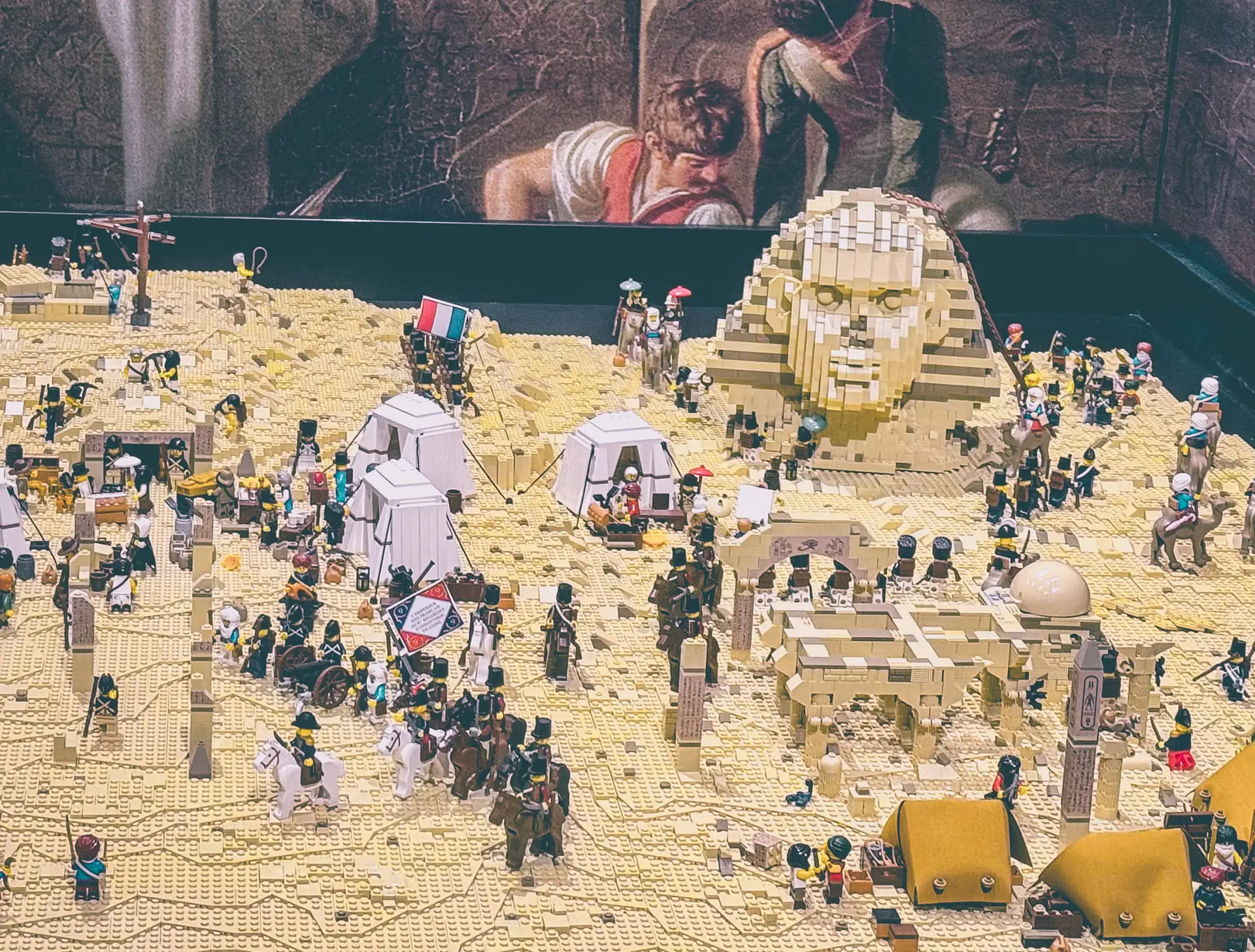 LEGO recreation of Napoleon's Egyptian campaign seen from above, with a large brick-built Sphinx and hundreds of minifigures around the French camp.