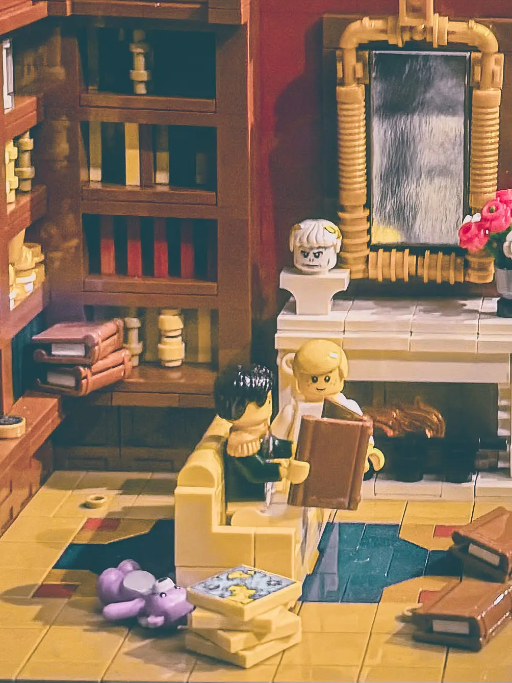 LEGO nursery scene with the young King of Rome, a purple teddy bear on the floor and a bust of his father on the mantelpiece.
